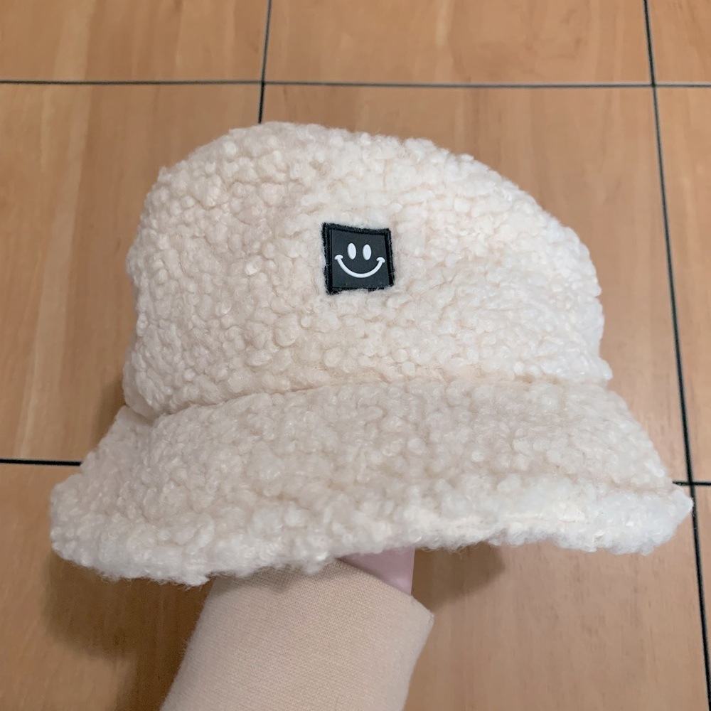 fluffy smiley face bucket hat
